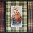 The trio of Tara James prints, the one in the middle depicting one of the Topp Twins as Mary, in...