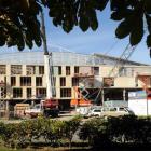 The University of Otago's building adjoining the western wall of the Forsyth Barr Stadium takes...
