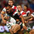The Warriors' Thomas Leuluai tries to break through the Dragons defence. Photo Getty Images