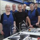 The winning Allied Press printing team is (from left) Laurie Finnerty, Troy Cooper, Steve Taylor,...