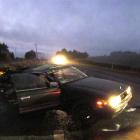 The wreckage of a sedan which was involved in a two-vehicle crash because of black ice near...
