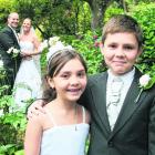 The young attendants, who are the bride's niece and nephew, at the wedding of Michaela...