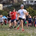Theo Baxter (28), of Dunedin, leads eventual individual men's winner Sam McCulloch (16), of...