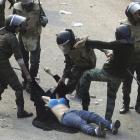 This image of army soldiers arresting a female protester in Cairo has angered women in Egypt and...
