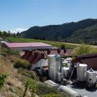 This photograph of Gibbston Valley Winery shows the existing winemaking facility - the barn-like...