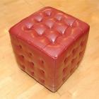 This red Bi-Cast leather buttoned cube is popular for children ($160 Arthur Barnett). Photo by...