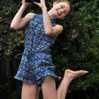 This year's winner, Madeline Bilkey, jumps for joy while holding the Canon EOS 7000 DSLR camera...