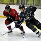 Thomas Stevens (Thunder) turns tightly around Fredrik Sparf (Red Devils) during their national...