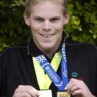Thomas van der Lugt shows off his Special Olympics World Winter Games gold and silver medals in...