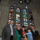 Thrilled to see their window on display are (from left) Maia stained glass artist Peter Mackenzie...