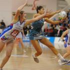 Thunderbirds wing defence Mo'onia Gerrard snares the ball ahead of Steel goal attack Donna...