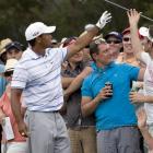 Tiger Woods has his club handed back by spectators after he bounced his driver so hard into the...