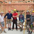 Tirohanga Camp manager Matt Stevenson (fourth from left), builder Darren Edwards (fifth from left...