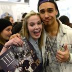 Titanium fan Tayla Anderson, of Dunedin, snuggles up to band member Jordi Webber.
