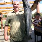 Toby Templeton, of Cromwell, with a 4.426kg (9.77lb) brown trout he caught in Lake Hawea on...