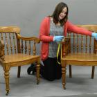 Toitu Otago Settlers Museum collections officer Beth Rees measures one of a pair of recently...