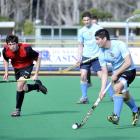 Tom Clarkson (University Blue) looks for opportunities upfield during the Dunedin men's club...