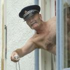 Constable Tom Taylor re-enacts his nude off-duty incident at his Balclutha house yesterday. Photo...