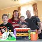 Toni and Carl Dock-Walshe are now back in their Oamaru dream house with sons Jamie, 11 (left) and...