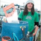 Tools of the trade: Apprentice plumber Sam Mitchell at work earlier this week.