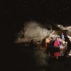 Tourists marvel at the glow-worms in a cave near Te Anau. Photo supplied.