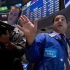 Traders on the floor of the New York stock exchange this week as commodities were hit hard. Photo...