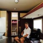 Trevor Nixon relaxes in his campervan, which has all the modern conveniences including toilet....