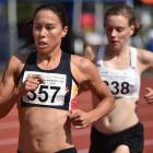 Triathlete Andrea Hewitt laps under-20 winner Kara Macdermid on her way to second in the women’s...