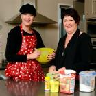 Trista Townsend and mother Elaine Schuck  prepare for next week's baking fundraiser. Photo by...