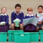 Trying out their new recycling bins courtesy of the Paper 4 Trees programme are St Joseph's...