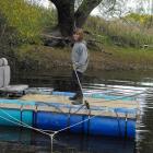 Tuapeka Mouth resident Meg Cowie (12) negotiates crossing the Tuapeka River in a raft while the...