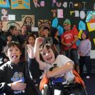 Tumai Cassidy (8, left), and Kiringaua Cassidy (6) participate in a Ka Puanani o Te Reo class at...