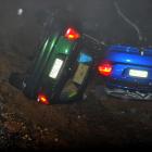 Two cars in a ditch after part of Highcliff Rd was swept away from in front of them last night....