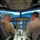 Two Jetstar pilots practise taking off from Queenstown Airport in a flight simulator in Melbourne...