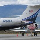 Two of the half dozen private and corporate jets parked at Queenstown Airport on December 31...