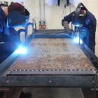 Two prisoners working in the Otago Corrections Facility weld steel bunks to be installed in the...