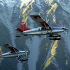 Two ski planes take to the air at Mt Cook, where pilots fly around mountainous terrain every day....