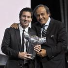 UEFA President Michel Platini (R) poses with Barcelona's Lionel Messi, who was named the Best...