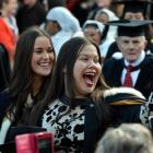University of Otago graduand Cheyne Stevens (22) waves to friends during the  university...