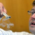 University of Otago physicist Associate Prof David Hutchinson with a small magnet hovering in mid...