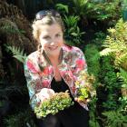 University of Otago postgraduate wildlife management student Kelly Frogley (23) holds samples of...