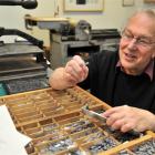 University of Otago printer-in-residence Dr John Holmes  prepares type in the Otakou Press Room...