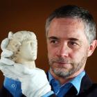 University of Otago Prof Robert Hannah examines the "Otago Alexander", an ancient marble head...