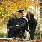 University of Otago psychology graduand Tim Young, flanked by parents Phil and Viv Young,...