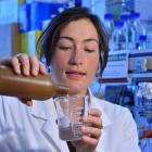 University of Otago researcher Dr Sara Hanning pours  a liquid intended to counter ''dry mouth''....
