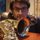 University of Otago student Burt Hatch has to make do with a friend's saxophone after his was...