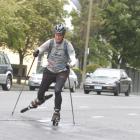 University of Otago student Scott Kvick (20) skikes through Dunedin yesterday, on his journey...
