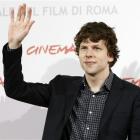 US actor Jesse Eisenberg waves at photographers during the photocall "The Social Network" at the...
