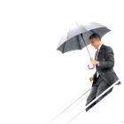 US President Barack Obama arrives under rainy skies in North Canton, Ohio, on his way to Kent...