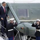 US President Barack Obama walks down the stairs of Marine One at Andrews Air Force Base, Maryland...
